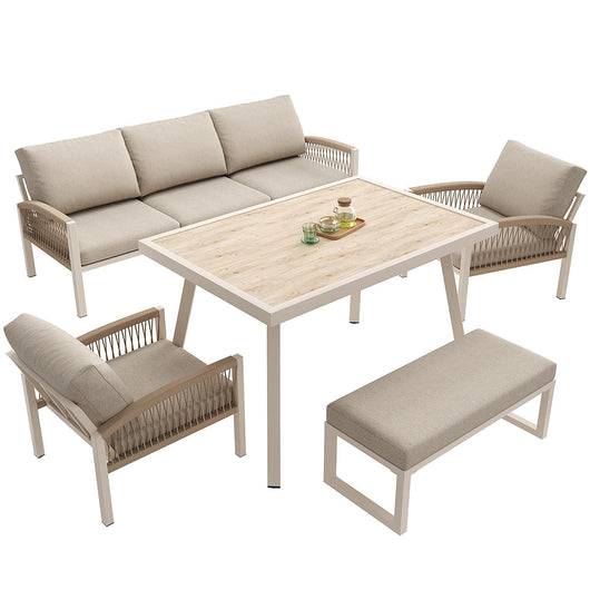 Set da giardino intrecciato a mano per 7 persone - Xylo - Struttura in ferro robusta con cuscini beige e tavolo in vetro effetto legno