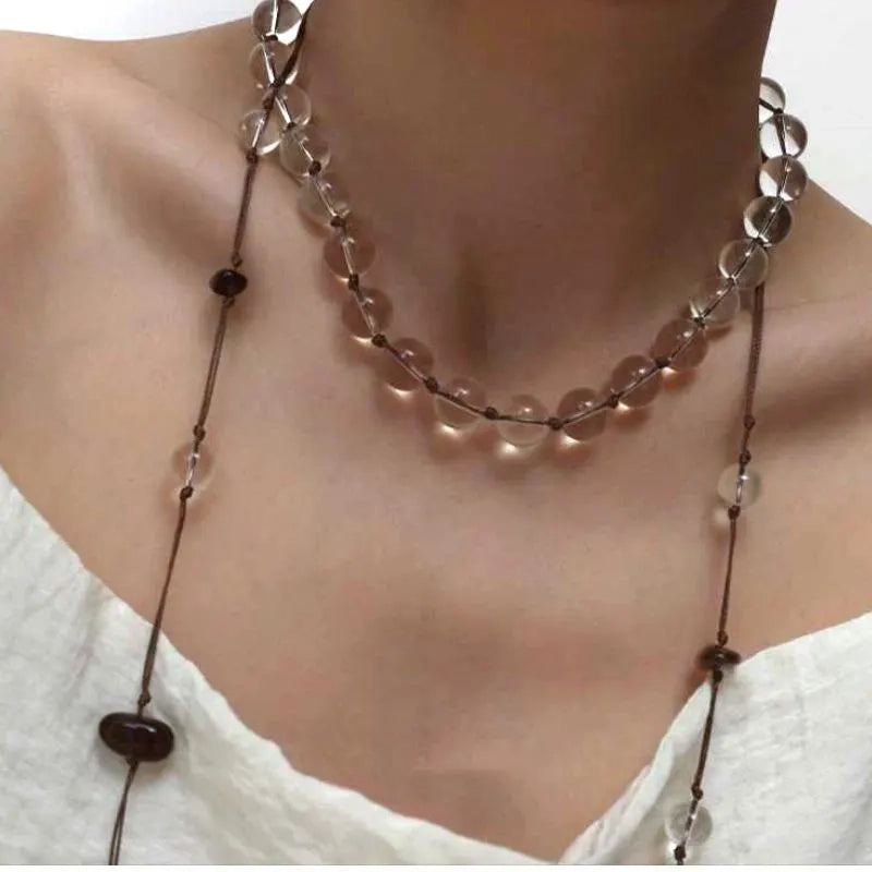 Collana in corda intrecciata e perle naturali: gioielli boho con nappe