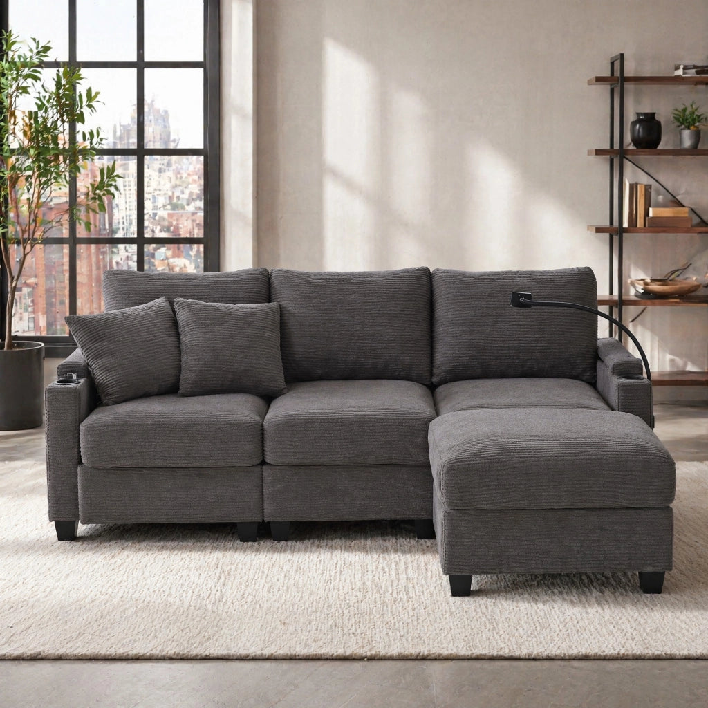 Divano angolare reversibile 3 a 4 posti con pouf, USB e vano portaoggetti, in velluto a coste, grigio scuro