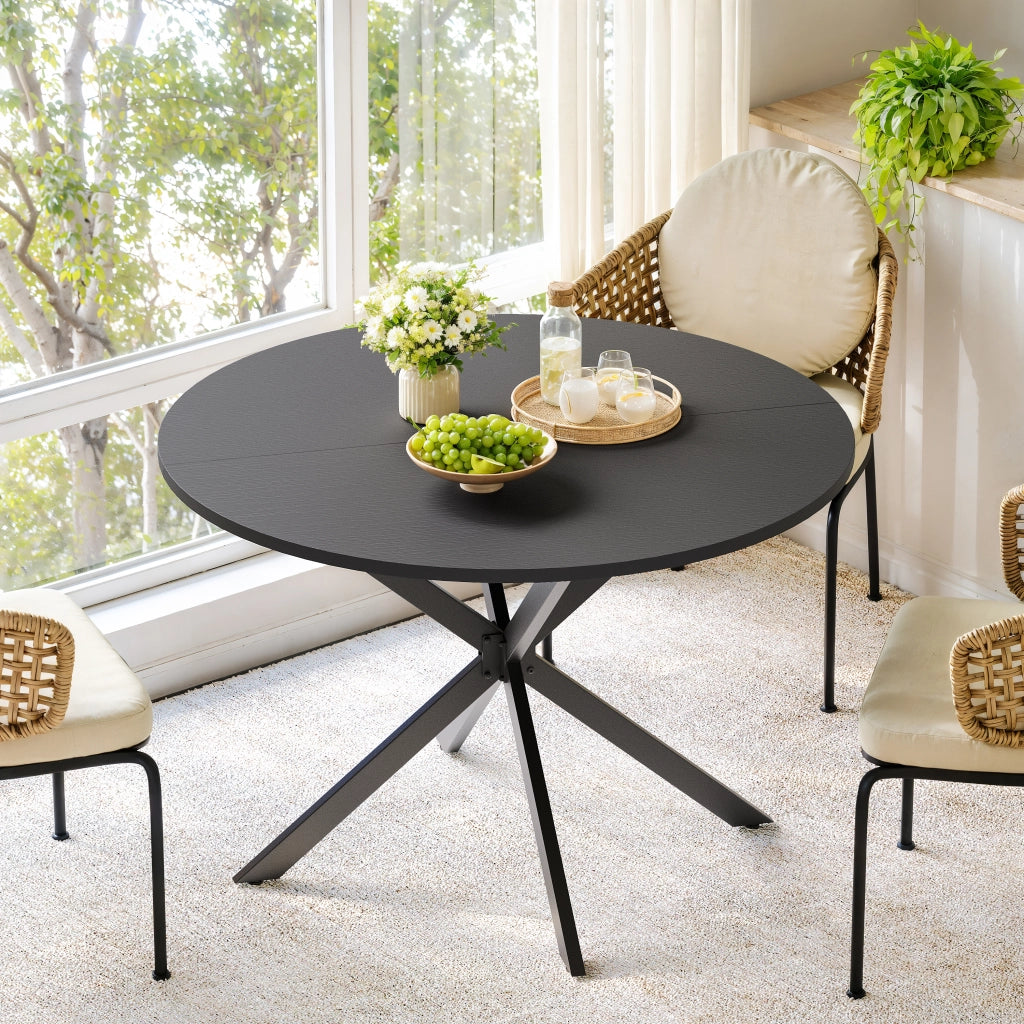 Tavolo da pranzo rotondo per 4-6 persone con base a X e piano in truciolare; per cucina e soggiorno; 120×76 cm; nero