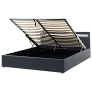 Letto matrimoniale in tessuto nero con LED 180 x 200 cm con contenitore e ottomana con doghe in legno