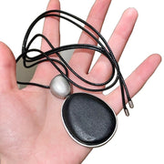 Collana in metallo e legno nero