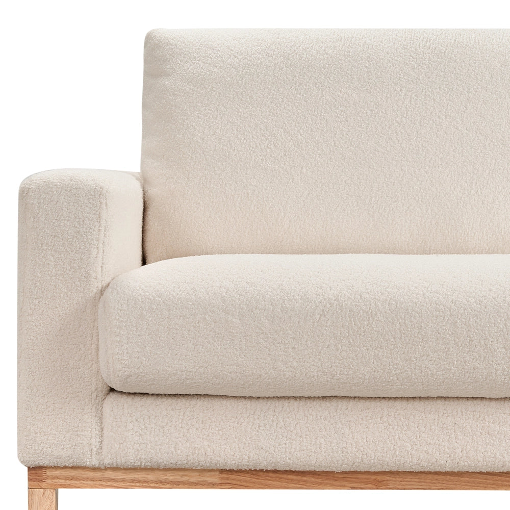 Divano angolare sinistro Rivestimento in bouclé bianco Gambe in legno Elegante