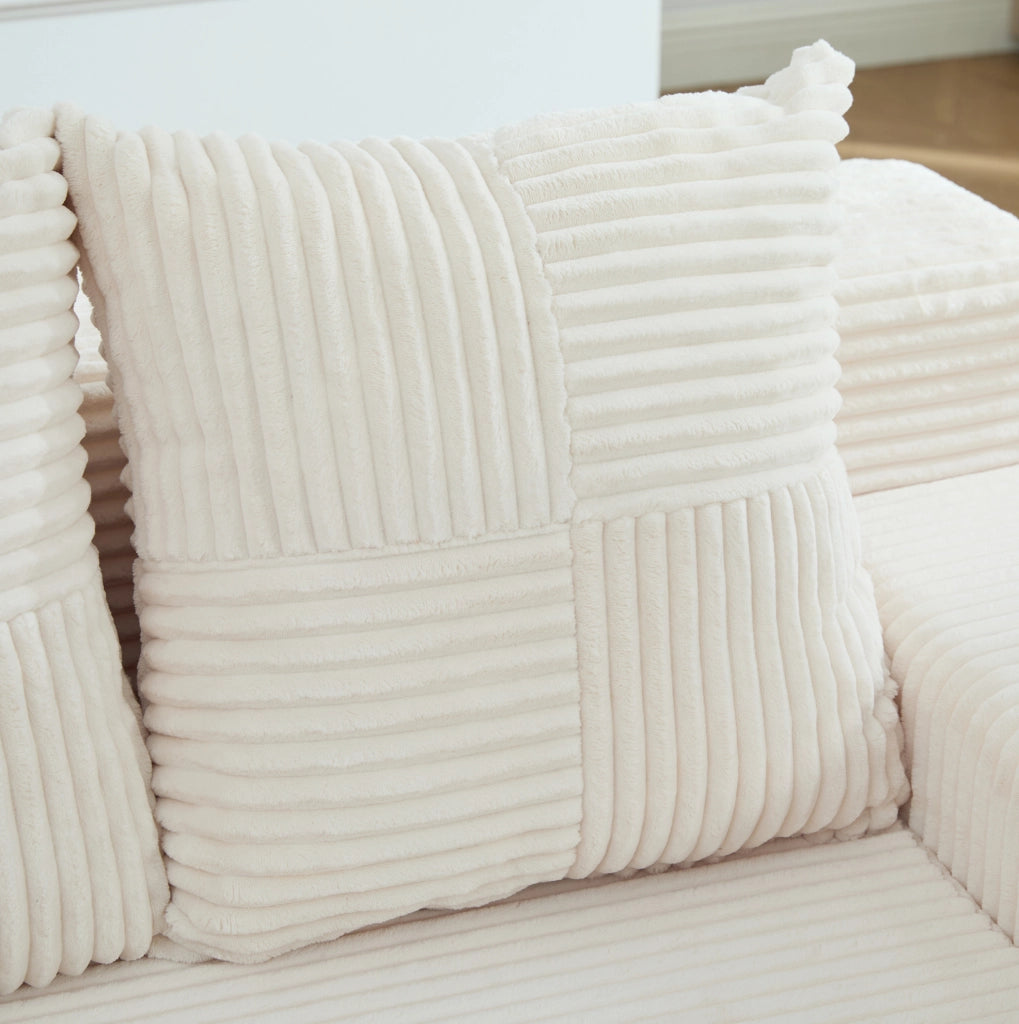 Pouf sofa in velluto a coste beige con 2 cuscini e tasche laterali; 151x133x64 cm