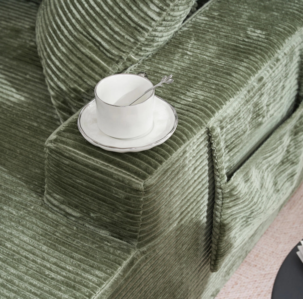 Divano letto compatto in corduroy verde con tasche laterali e cuscini; seduta con schiuma ad alta densit脿
