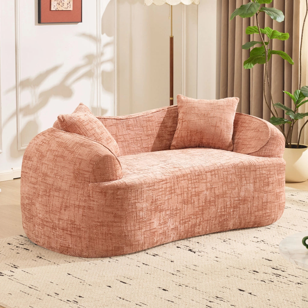 Divano curvo a due posti con supporto ergonomico e cuscini, in schiuma e molle rosa per soggiorno e camera da letto