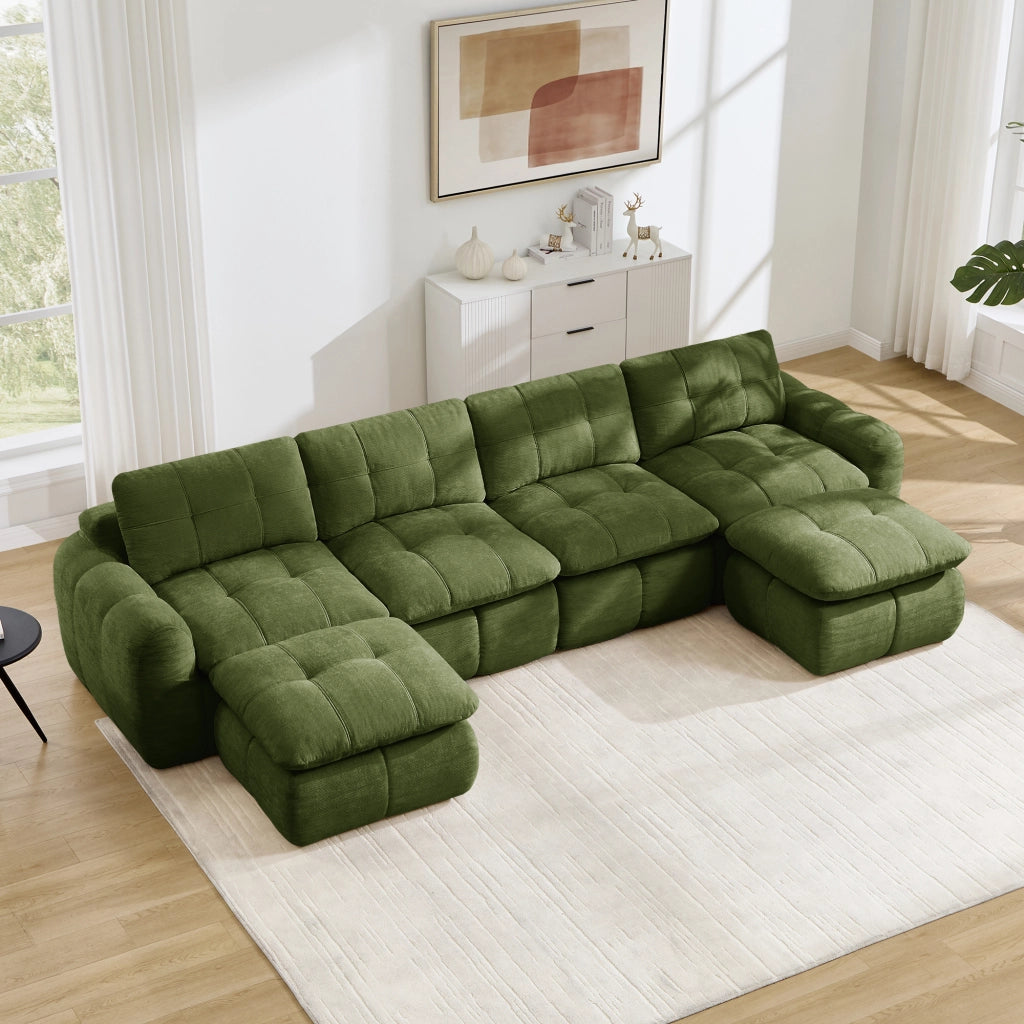 Divano modulare a U senza struttura con seduta ampia e profonda design trapuntato in ciniglia verde con due pouf