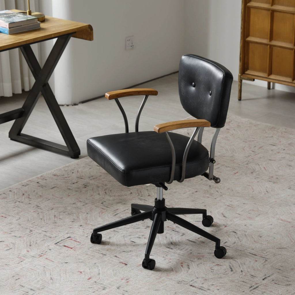Sedia da ufficio ergonomica girevole con rotelle in pelle premium e struttura in metallo per ufficio domestico nera