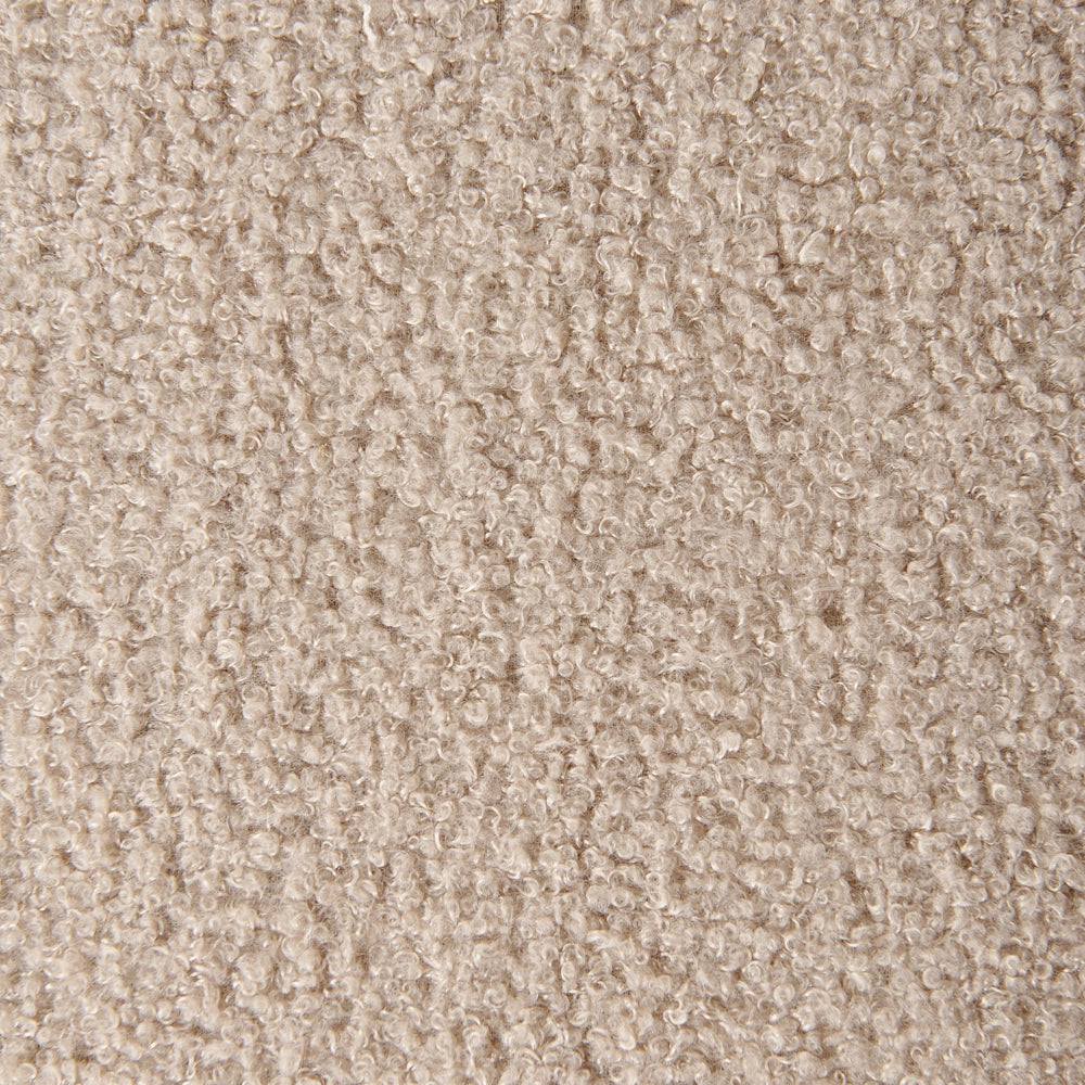 Poltrona in tessuto bouclè beige bianco con cuscino rotondo stile glamour retrò soggiorno