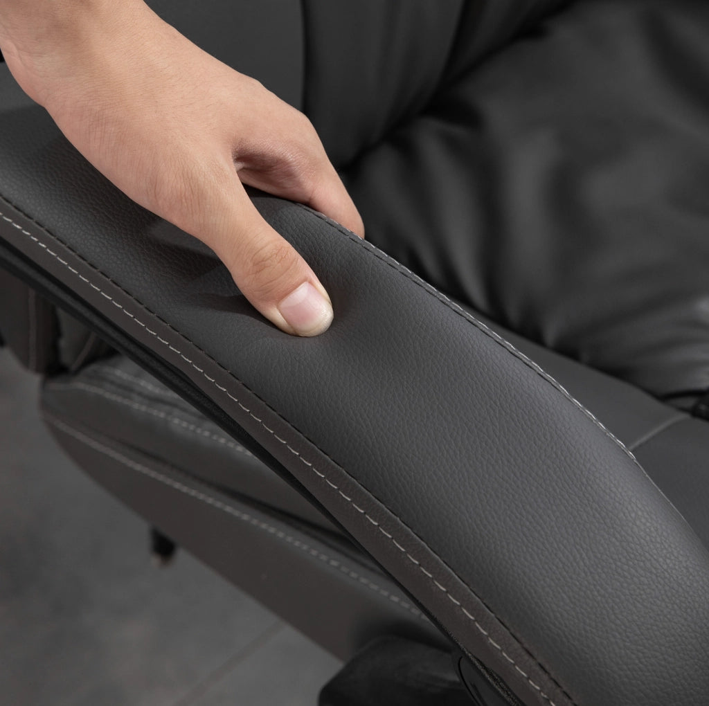 Poltrona da ufficio ergonomica con massaggio, reclinabile e poggiapiedi per comfort prolungato