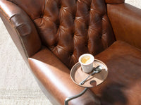 Poltrona Chester in pelle marrone cognac