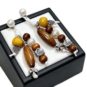 Orecchini vintage con perline di legno ispirati allo stile Zen.