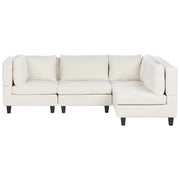 Divano componibile 4 posti imbottito in tessuto bianco gambe nere schienale  imbottito lato sinistro stile moderno