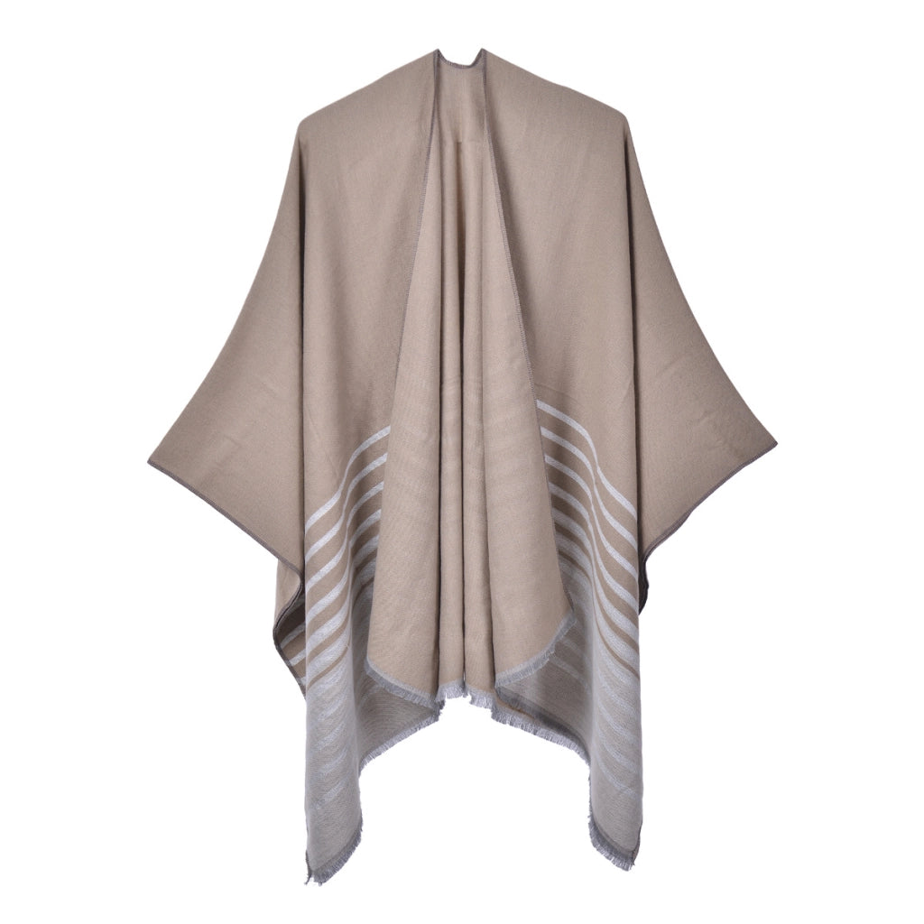 Mantella calda da donna reversibile in maglia con spacco e nappine.