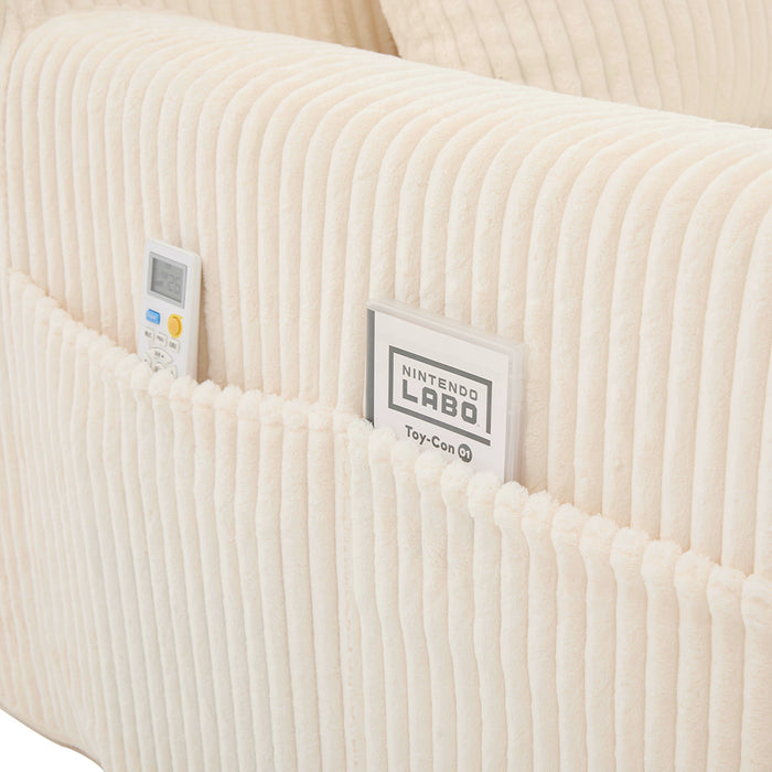 Poltrona oversize - Xylo - Velluto costato con tasche laterali, pouf e nessun assemblaggio