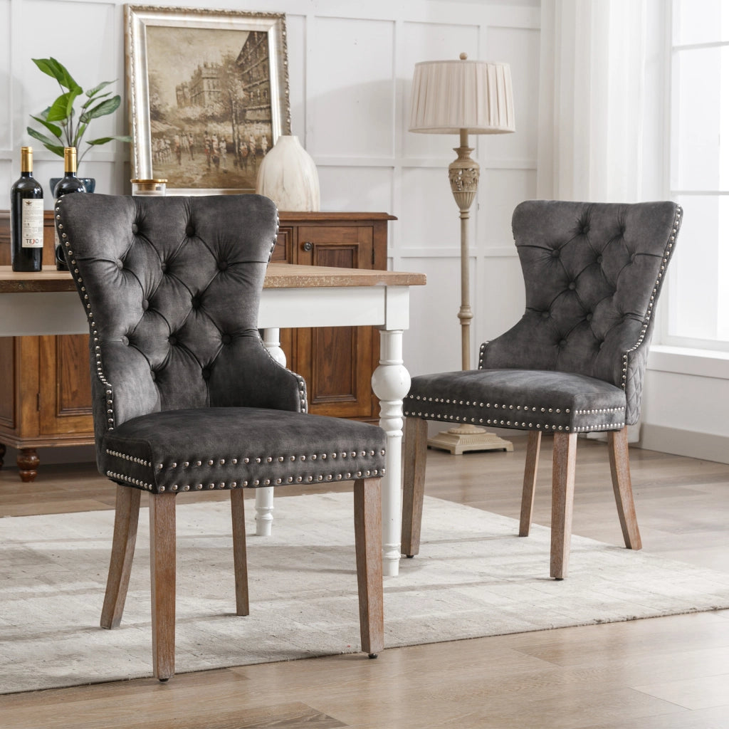 Sedia da pranzo imbottita con gambe regolabili, borchie decorative e anello posteriore, in velluto grigio