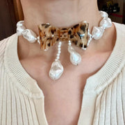 Collana di perle a forma di fiocco fatta a mano, regalo di Natale o di compleanno.