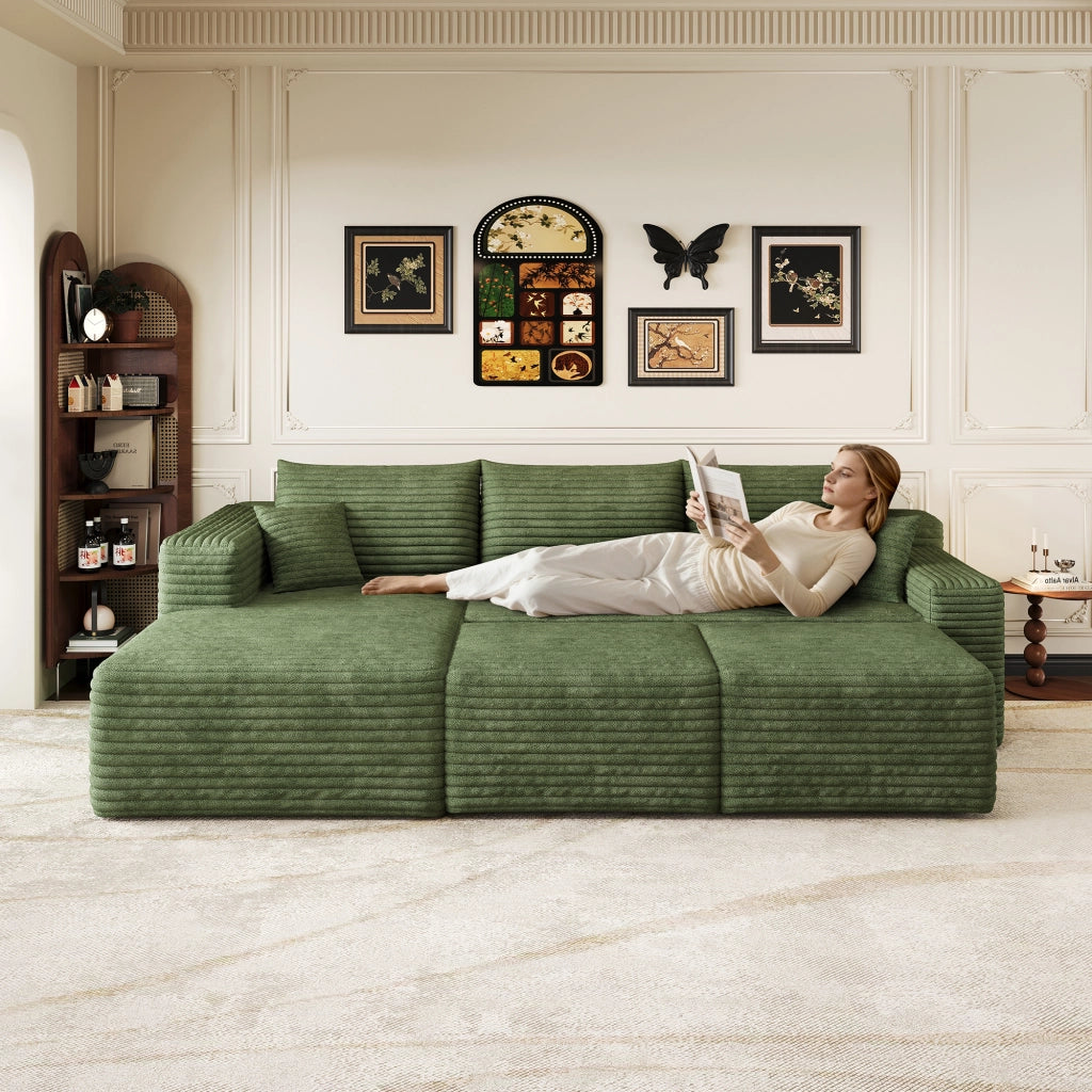 Divano angolare modulare senza montaggio in velluto a coste, seduta profonda e design minimal, verde
