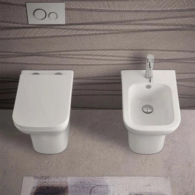 Wc filomuro bianco lucido senza brida con scarico multiplo  Plana