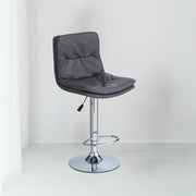 Sgabello Paco con seduta in ecopelle grigio e gamba in metallo inox