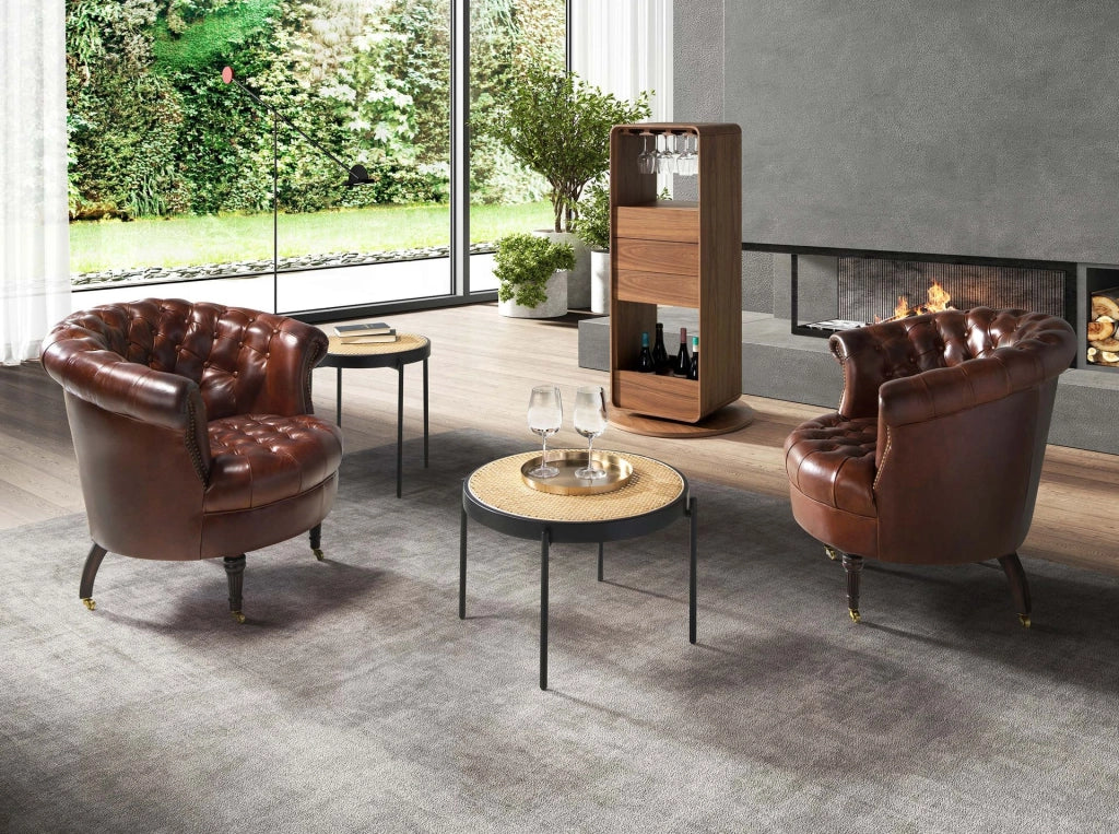 Poltrona Chester con seduta circolare in pelle marrone cognac
