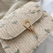 Borsa da messaggio in paglia estiva con fiori in ragnatela e laccio da spalla