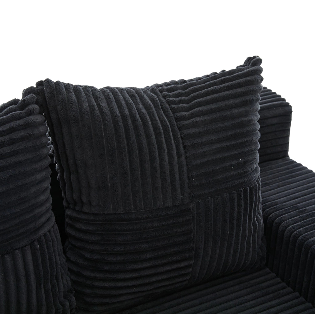 Divano pouf in velluto a coste nero 151x133 cm con tasche laterali e 2 cuscini HOMVRA