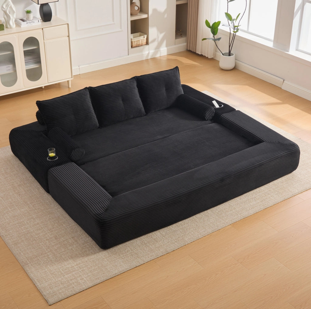 Divano letto ULEVR 232x98 cm in velluto a coste nero con portabevande, tasche laterali e cuscini memory