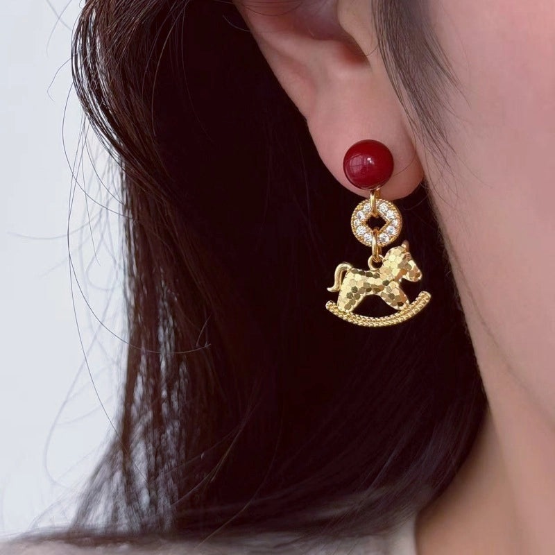 Orecchini a forma di pony rosso e moneta