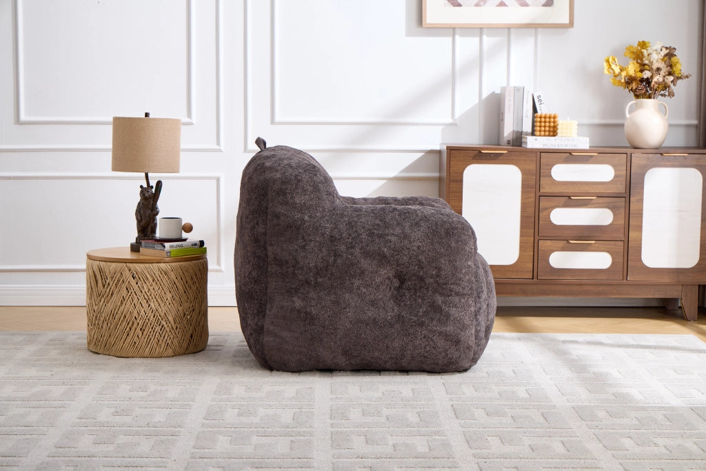 Pouf con imbottitura in schiuma sminuzzata e schienale ergonomico con braccioli, in pelliccia sintetica, grigio scuro