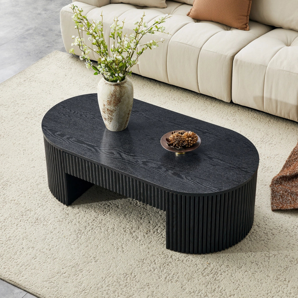 Tavolino da caffè ovale 118x65x17 cm con cassetto estraibile e scanalature verticali in MDF nero