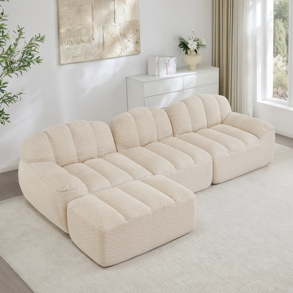 Divano modulare ad angolo con seduta profonda e pouf, per soggiorno, in pile granulato beige bianco 288 × 165 × 79 cm