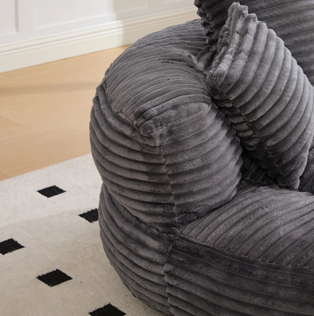 Poltrona sacco in velluto a coste con schienale alto e braccioli; 108 x 108 x 52 cm; grigio scuro