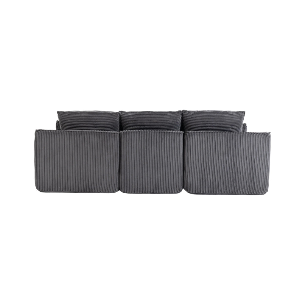 Divano modulare in corduroy grigio scuro con cuscini, tasche laterali e poggiapiedi