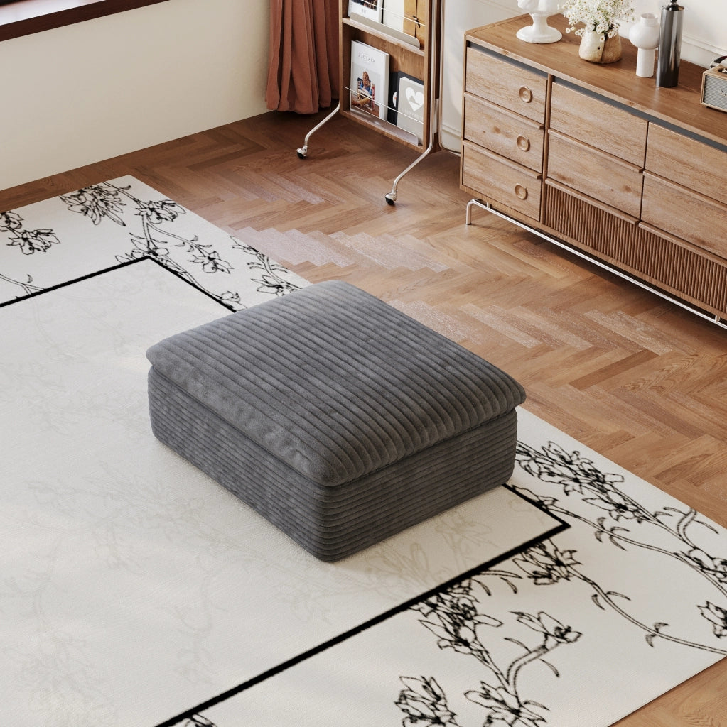 Divano modulare in tessuto grigio scuro con supporto in schiuma; design componibile