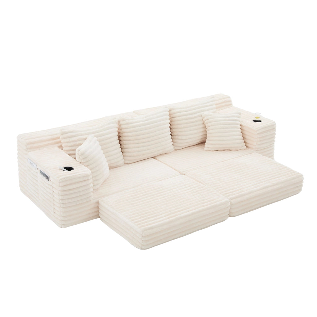 Divano in tessuto corduroy beige con schienale alto, cuscini, tasche laterali e portabicchieri