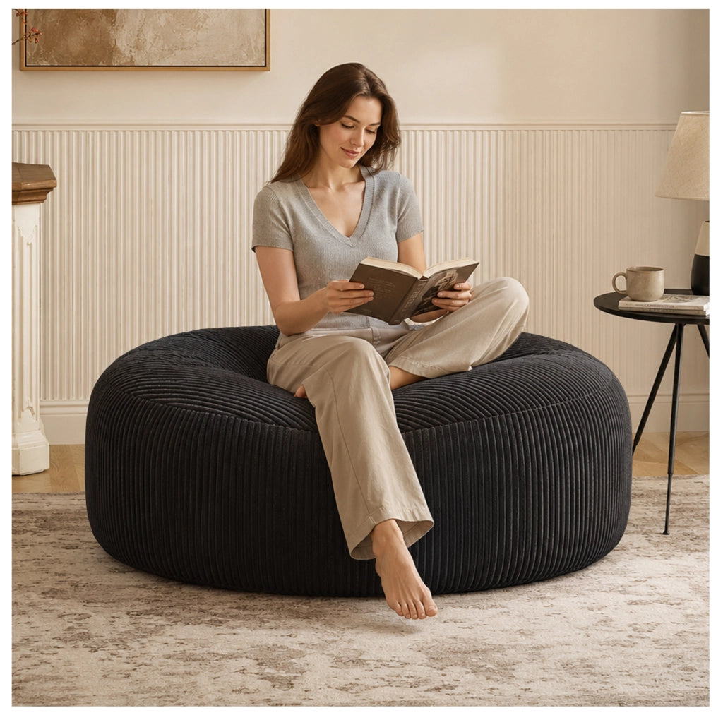 Poltrona sacco rotonda con imbottitura in memory foam; velluto a coste nero