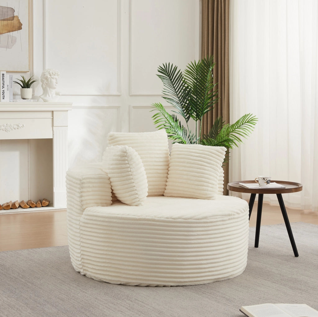 Poltrona lounge rotonda beige in velluto a coste con tre cuscini