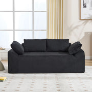 Divano senza struttura compatto in tessuto nero; 67 x 45 x 67 cm; con schienale alto e tasche laterali
