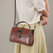 Borsa a mano da donna in vera pelle, colore marrone.