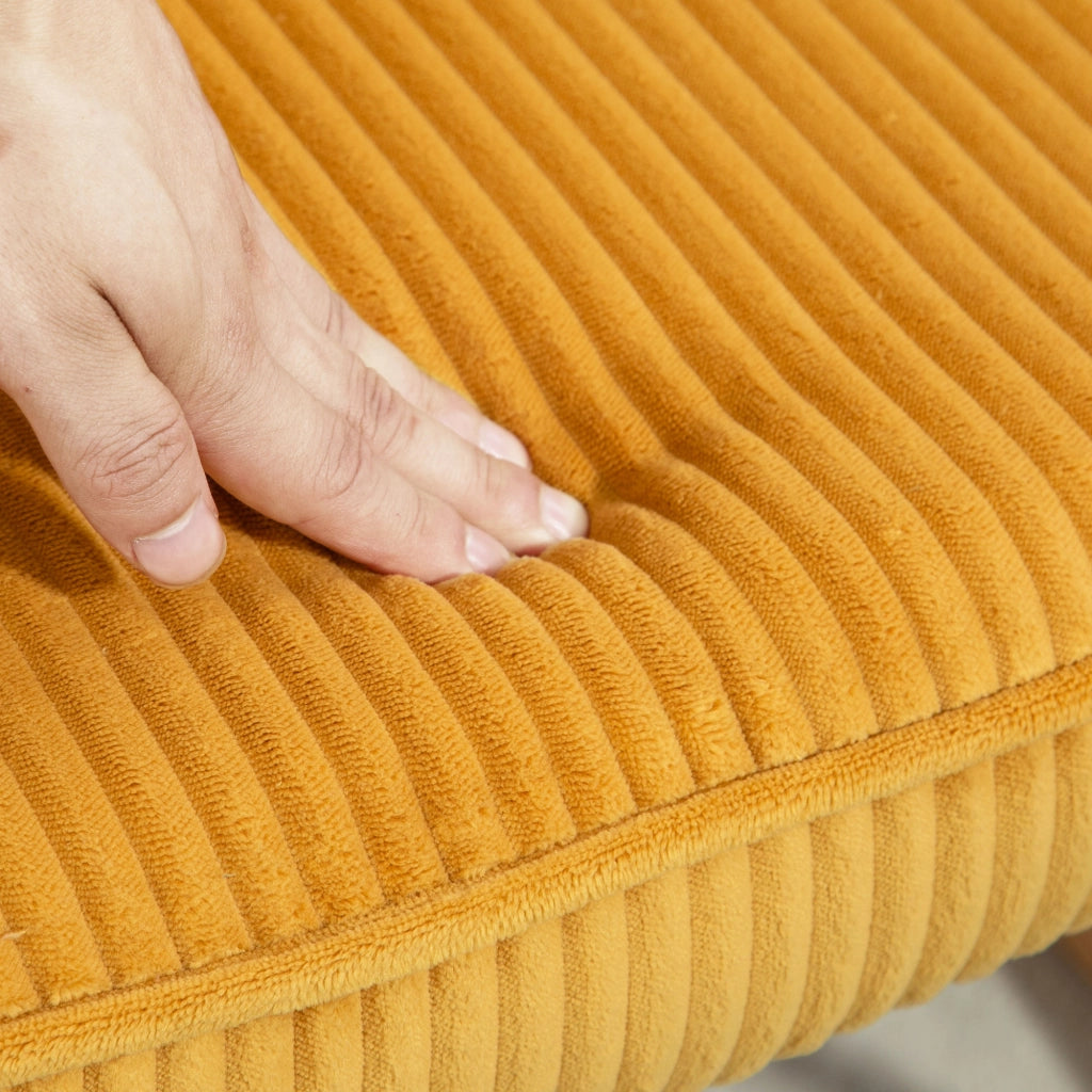 Fauteuil a dondolo con rivestimento in velluto a coste, schienale alto e braccioli, struttura in acciaio giallo