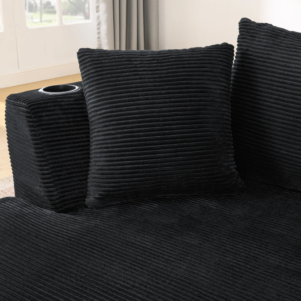 Divano a 3 posti dal design curvo in tessuto corduroy nero; con portabicchieri e cuscini