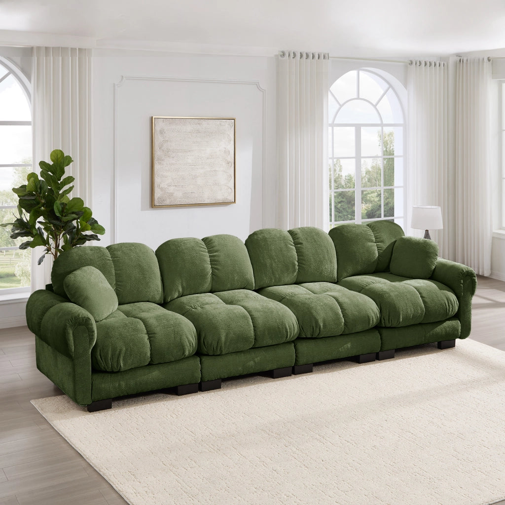 Divano modulare in chenille verde con braccioli curvi e cuscini trapuntati 330x86x90 cm
