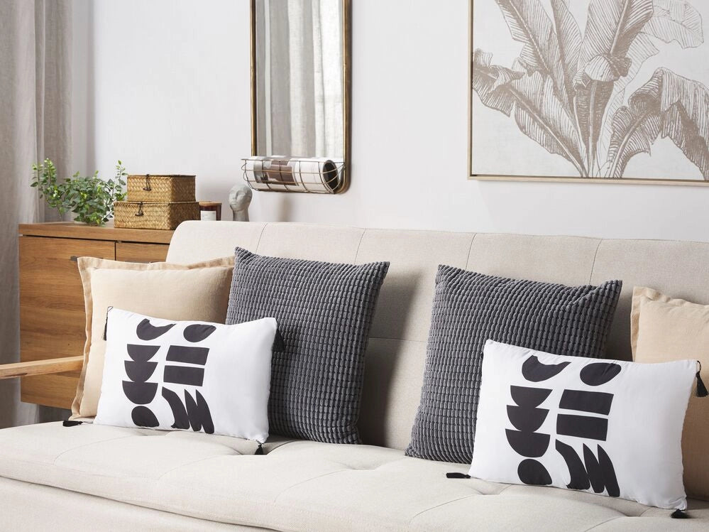 Set di 2 cuscini motivo geometrico nappe 30 x 50 cm bianco e nero