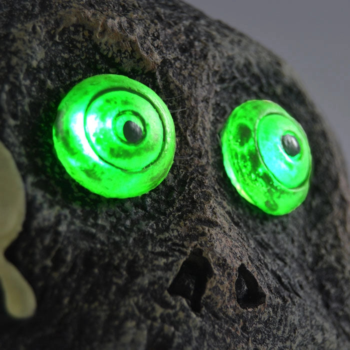 Teschio a Forma Pietra per Halloween con Occhi a LED Verdi