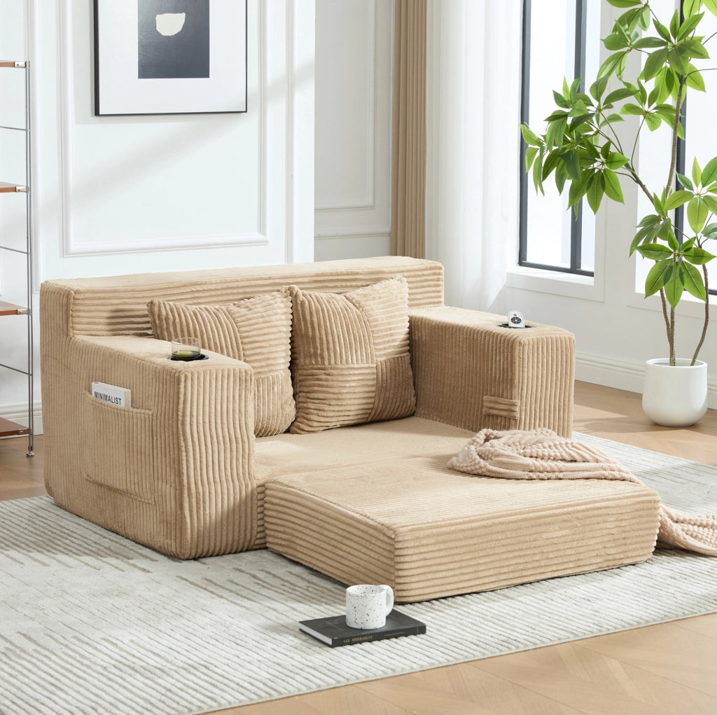 Divano pouf in velluto a coste kaki con tasche laterali e 2 cuscini; 151 x 133 x 64 cm