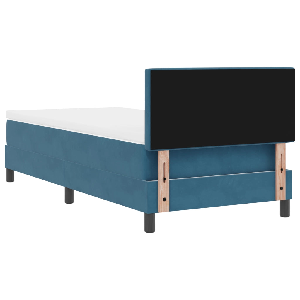 letto a box spring con materasso blu scuro in velluto