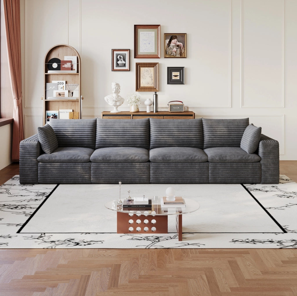 Divano modulare in tessuto grigio scuro con supporto in schiuma; design componibile