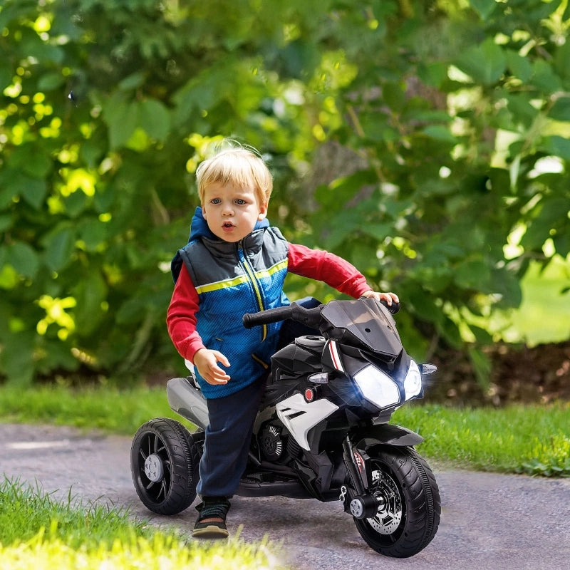 Motocicletta elettrica per bambini, con luci e suoni, 3 km/h, ricaricabile, in plastica e metallo, colore nero/bianco