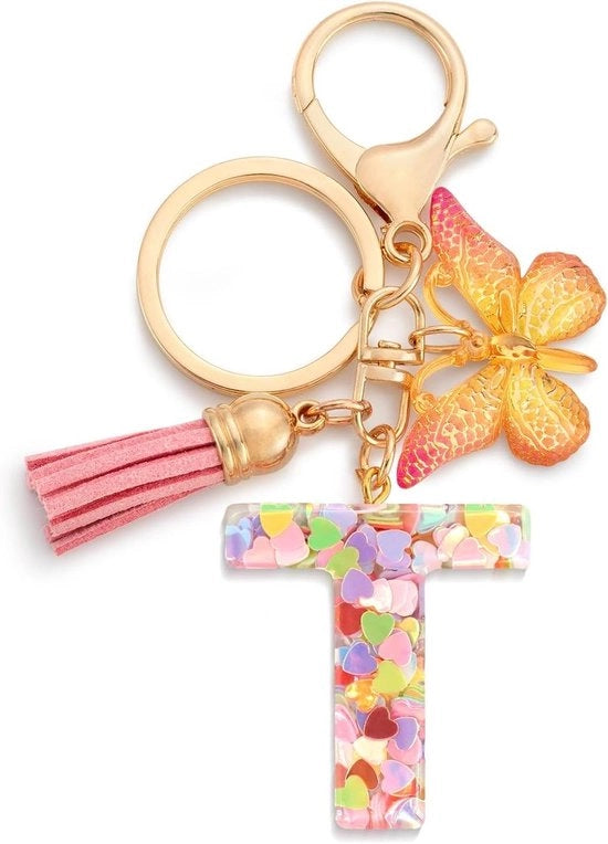 Schiaccianoci per bambine con iniziale farfalla rosa in design